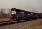 NS 7001 leads a train southbound